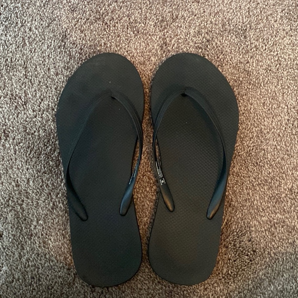 Size 7, black flip flops